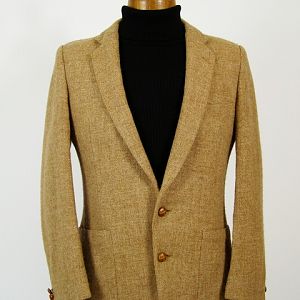 Light brown Harris Tweed jacket with patch pockets.