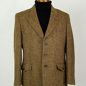 Harris Tweed jacket with buttoned flap pockets.