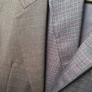 This album presents a photo comparison of two Hickey Freeman jackets: a 1980s vintage Boardroom Collection suit jacket in a navy bird's eye wool, and a 2010 Vanguard sport coat in a navy and blue plaid wool. For reference, both are size 40L.