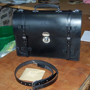 A black Bridle leather Brief case. all hand stitched, except for the partition board binding.