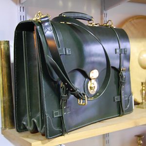 An XL sized, Scallop fronted, 3 pocket/2 partition brief case, in a dark Green bridle leather I had made for me. Entirely hand stitched, except for the partition board top binding.