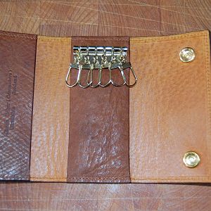 A Key pouch in Russian Reindeer hide, this had embossed initials on the outside, lined with a glazed pigskin, machine stitched.