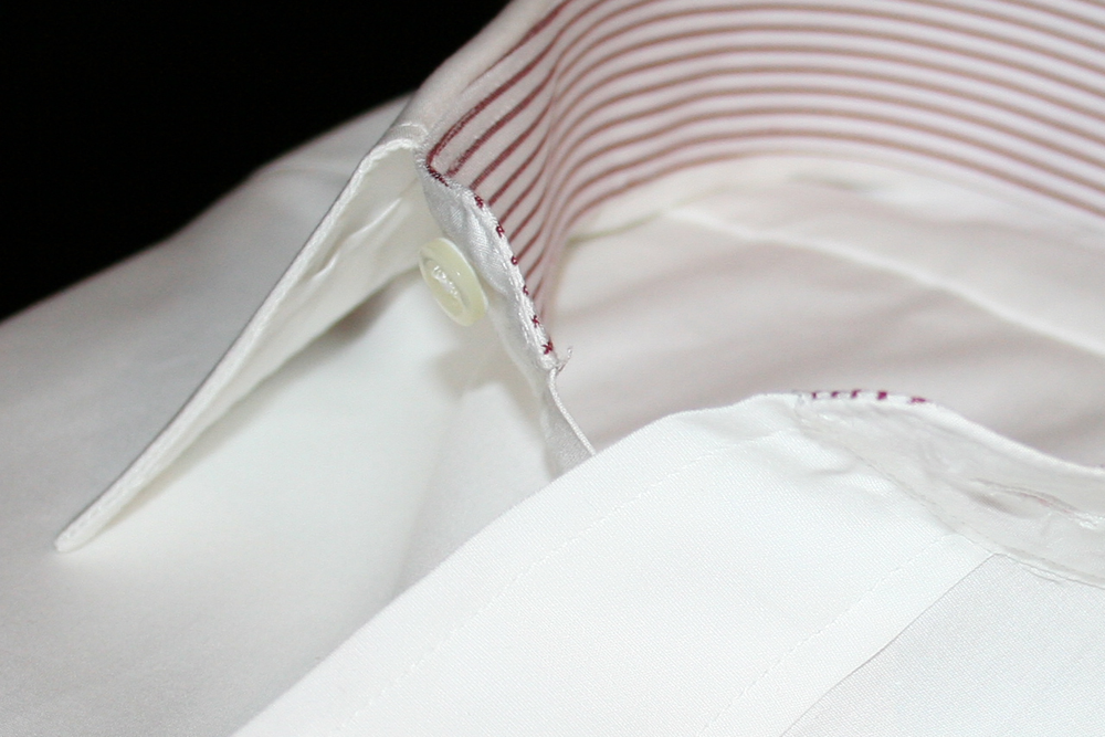 This beautiful custom dress shirt from Proper Cloth features a white oxford cloth, point collar, french cuffs, and unique collar stand and french cuff accents.