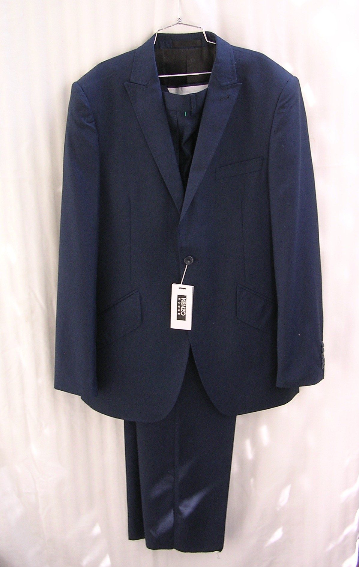 Kenzo Homme suit says material is 65% W 