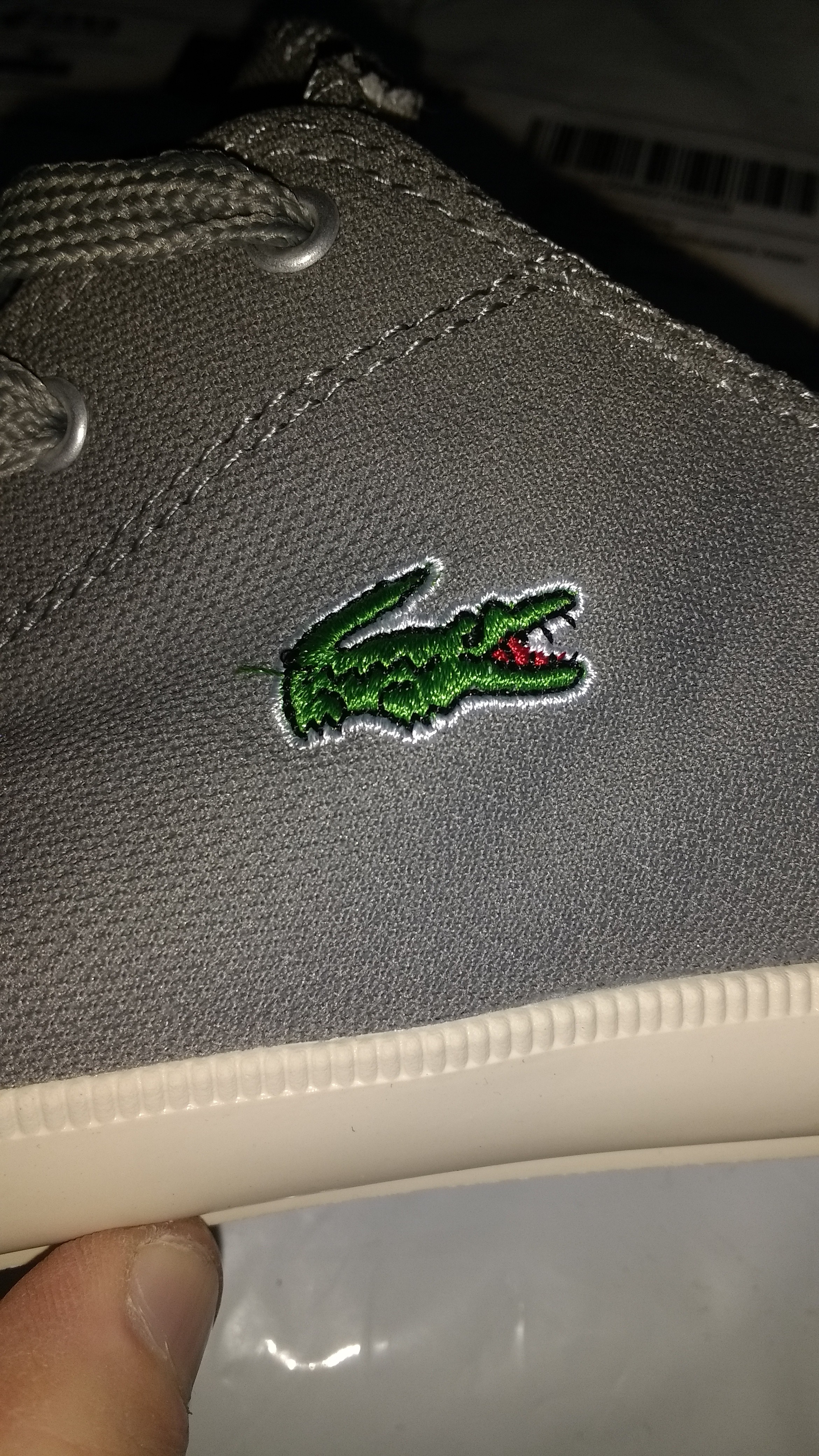 original lacoste bag logo vs fake