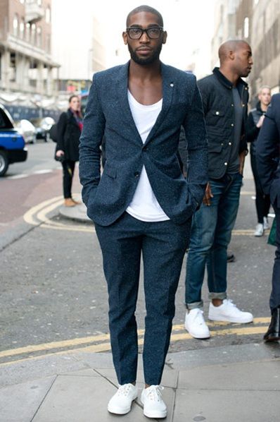 navy suit white trainers