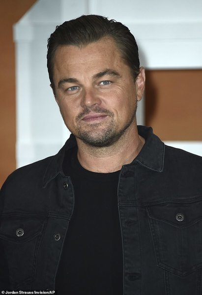 15944828-7239221-Cool_Leo_The_Wolf_of_Wall_Street_actor_wore_all_black_in_a_tee_j-a-65_1562899...jpg