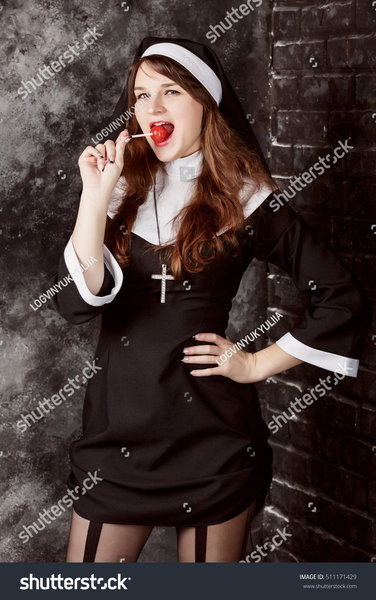 stock-photo-young-sexy-nun-in-stockings-licking-a-red-candy-on-a-dark-background-attractive-wo...jpg