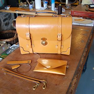 An entirely hand stitched London colour 3 pocket briefcase, with extra corners, shoulder strap, valuables pouch, and a pair of detachable lanyards.