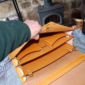 The inside detailing, bespoke pockets, with pen loops, and a pair of D-rings to attach lanyards to. Partition boards are Sedgwicks bridle butt, as is all strapping, the front and back of the case.