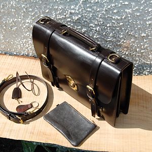 A Dark Havana 2 pocket scalloped briefcase, entirely hand stitched.