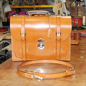 A light Havana 3 pocket briefcase with chromed brass fittings, entirely hand stitched.