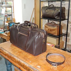 A Sedgwicks dark havana bridle panel hide hold-all, all strapping is sedgwicks bridle butt, the handles, handle chapes and the shoulder strap are hand stitched.