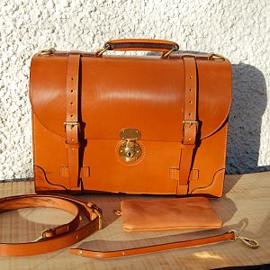 A hand stitched Light Havana 2 pocket briefcase, with polished brass fittings. extra corners and accessories