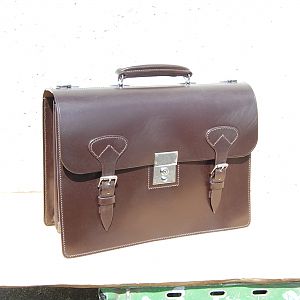 An entirely hand stitched 3 pocket briefcase, with oval front chapes, and chrome fittings, in Sedgwicks dark havana.