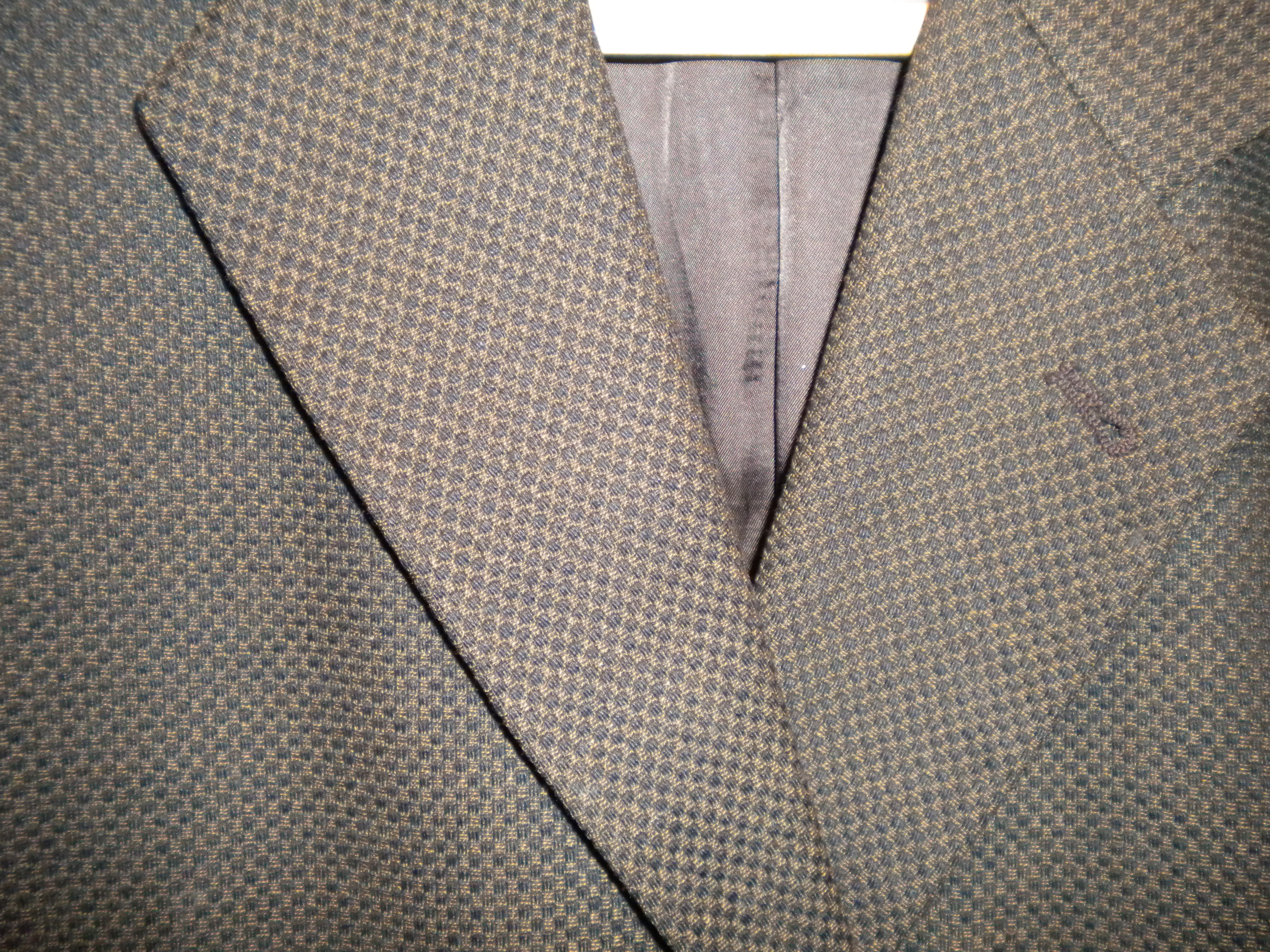 Close up Nails head pattern on Joseph Abboud bespoke coat