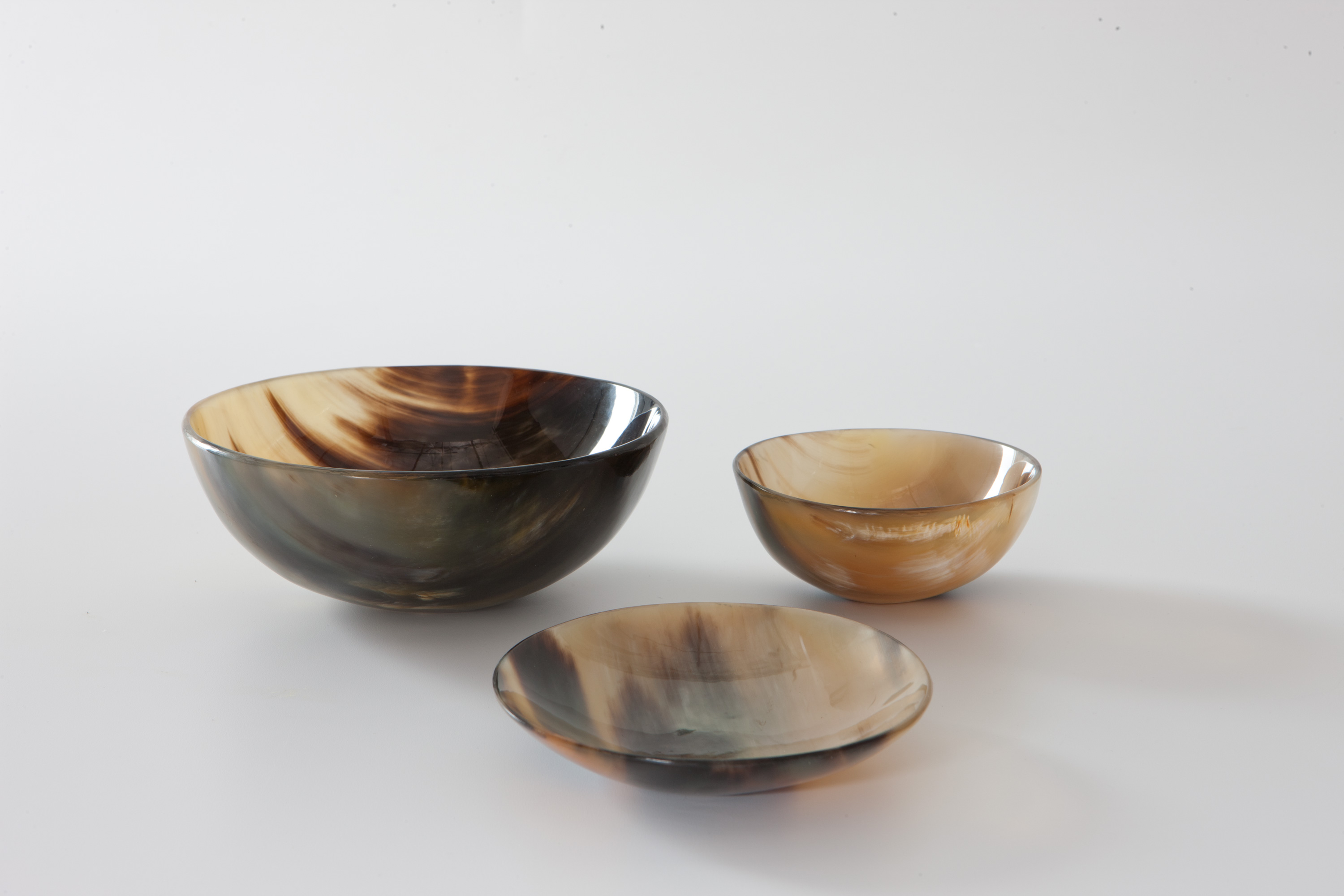 Some change bowls from AbbeyHorn. Each one features it's own unique marbling of creams and black.